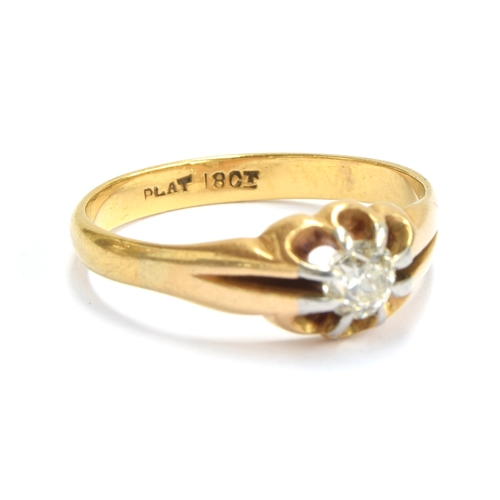 5 - An early 20th century 18ct gold diamond solitaire ring in a buttercup setting with platinum tipped c... 