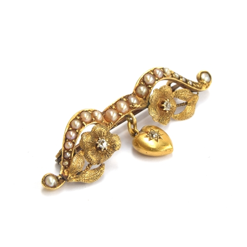 4 - A Victorian 18ct gold, diamond and seed pearl brooch in the form of a bow adorned with flowers suspe... 