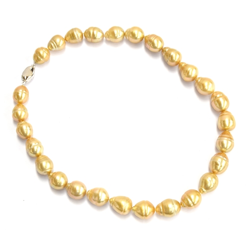 141 - A golden South Sea pearl necklace, the 27 pearls ranging from 1.2cm to 1.5cm, 43cm unclasped length,... 