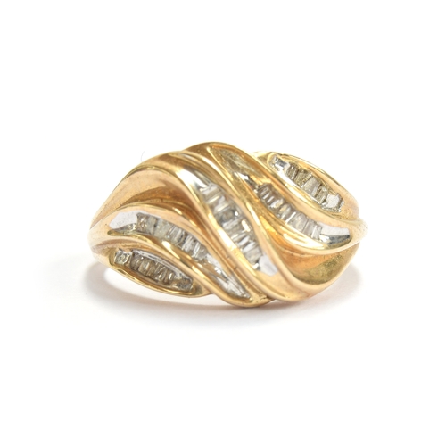 26 - An 18ct gold ring set with baguette cut diamonds in a wavy design, size M 1/2, 3.5g