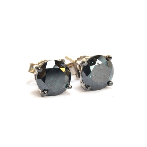 68 - A pair of 9ct white gold and blue treated diamond earrings, totalling 2cts

Provenance: private coll... 