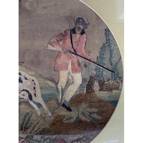 278 - A Georgian woolwork depicting a man wildfowling with two dogs, 30.5x36cm