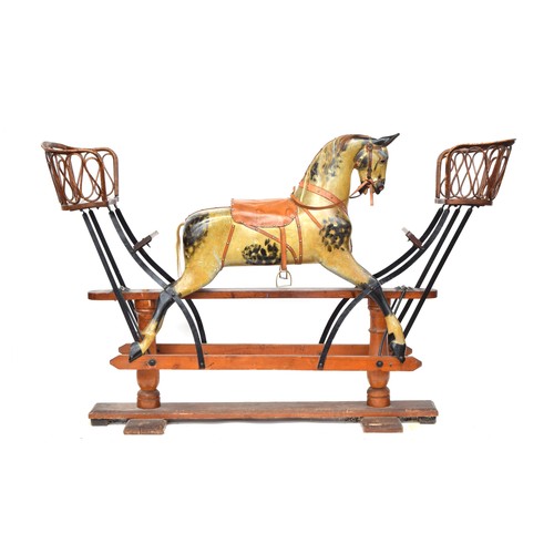 431 - A very large rocking horse, probably by F.H. Ayres, on safety stand, carved and  painted, with amber... 