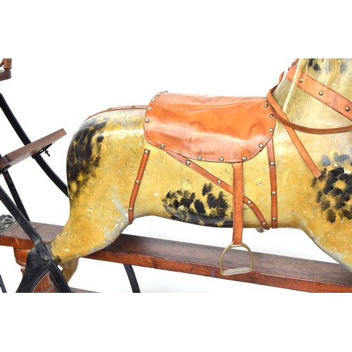 431 - A very large rocking horse, probably by F.H. Ayres, on safety stand, carved and  painted, with amber... 