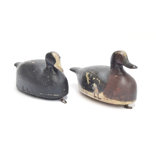 352 - A folk art painted wooden decoy duck and moorhen, 28cm and 30cm long (2)

Provenance: private collec... 