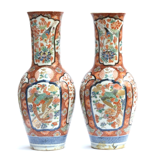 262 - A pair of large decorative Japanese vases, depicting samurai and phoenix in polychrome enamel decora... 