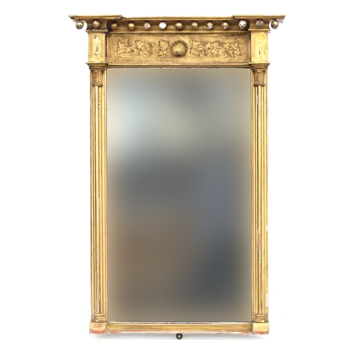 336 - A large Regency gilt gesso pier mirror, invert break pediment with ball moulding, grape and vine fri... 