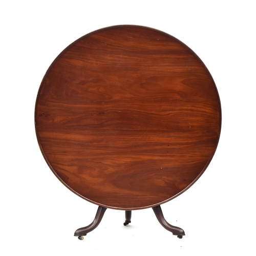 390 - An 18th century and later tripod table, the large dished tilt top with birdcage action, on a turned ... 