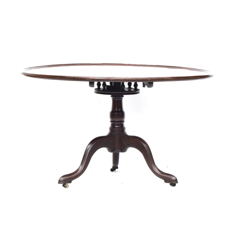 390 - An 18th century and later tripod table, the large dished tilt top with birdcage action, on a turned ... 