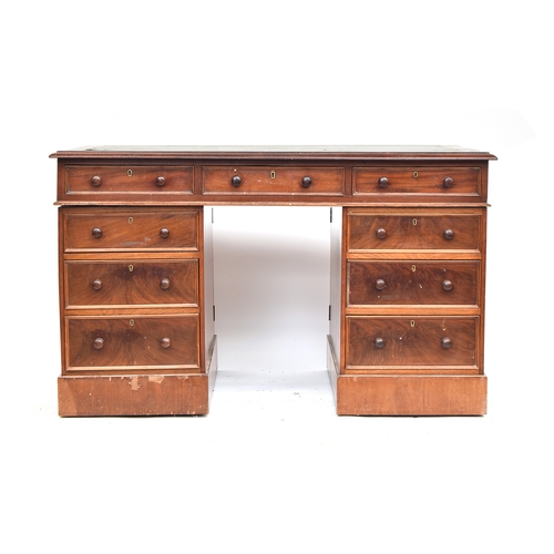 428 - A late 19th century pedestal desk, with gilt tooled leather skiver over the traditional arrangement ... 