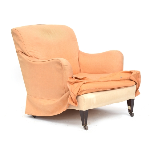 438 - An early 20th century armchair in the manner of the Howard Bridgewater, 80cm wide