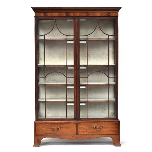 415 - A 19th century astragal glazed display cabinet, with adjustable shelves, over two drawers on swept b... 