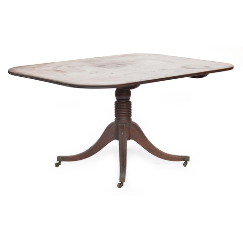 409 - A Regency mahogany rectangular tilt top breakfast table, on a ring turned column and four swept legs... 