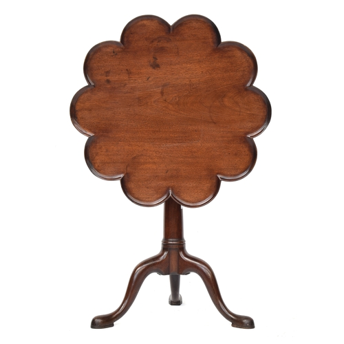 386 - A George III mahogany tilt top tripod table, the moulded scalloped top with birdcage action, on a gu... 