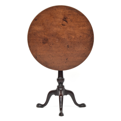 388 - A George III mahogany tilt top tripod table, the circular top on birdcage action, vase turned column... 