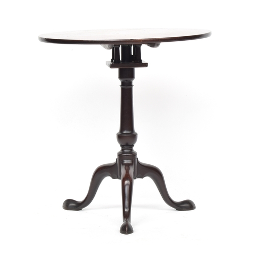 388 - A George III mahogany tilt top tripod table, the circular top on birdcage action, vase turned column... 