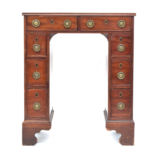 408 - A unusually proportioned George III kneehole writing desk, with eight drawers, the pedestals with do... 