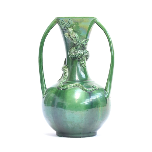 255 - A large Chinese green glazed twin handled vase with coiled dragon decoration, 35cm

Provenance: priv... 