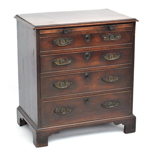 379 - A neat George III mahogany bachelor's chest, with brushing slide over four graduating drawers, on br... 