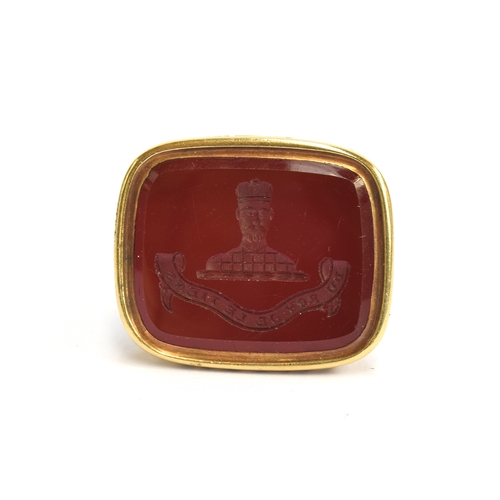 2 - A Georgian yellow metal seal, the carnelian intaglio carved with a King above the Royalist motto 'Du... 