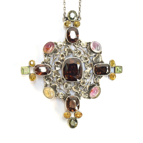 21 - Attributed to Amy Sandheim, a c.1920s Arts and Crafts silver gem set pendant, the openwork silver in... 