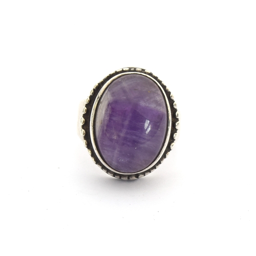 23 - Peter Guy Watson, a silver and amethyst Modernist ring, stamped PGW and hallmarked for London 1973, ... 