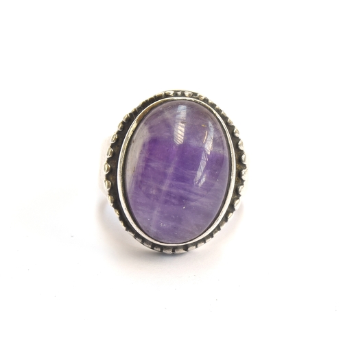 23 - Peter Guy Watson, a silver and amethyst Modernist ring, stamped PGW and hallmarked for London 1973, ... 