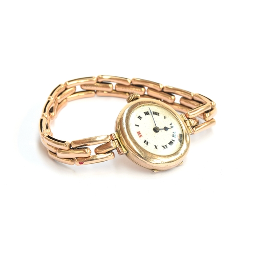 161 - An early 20th century ladies 9ct gold cased watch with enamel dial, on a 15ct gold Britannic expandi... 