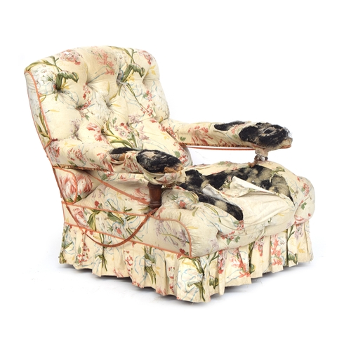 439 - A 19th century button upholstered armchair by Howard and Son, number stamped to rear leg, the caster... 