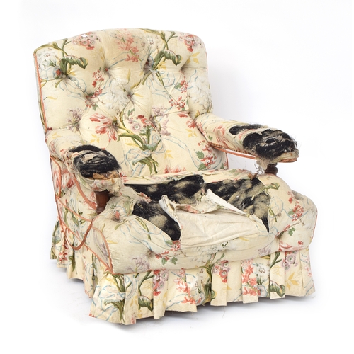 439 - A 19th century button upholstered armchair by Howard and Son, number stamped to rear leg, the caster... 