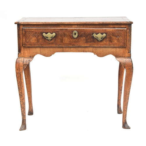 374 - A George II walnut and cross-banded lowboy, the quarter veneered top over single drawer, on cabriole... 