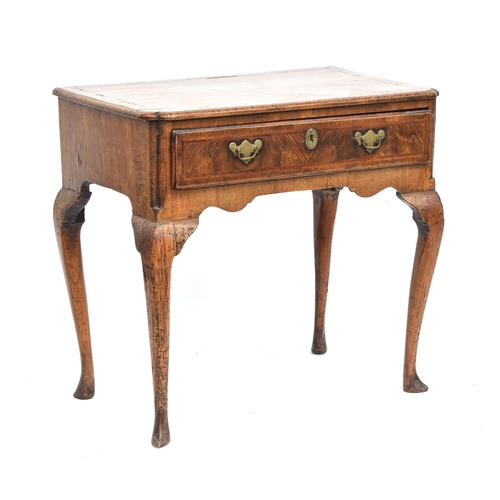 374 - A George II walnut and cross-banded lowboy, the quarter veneered top over single drawer, on cabriole... 