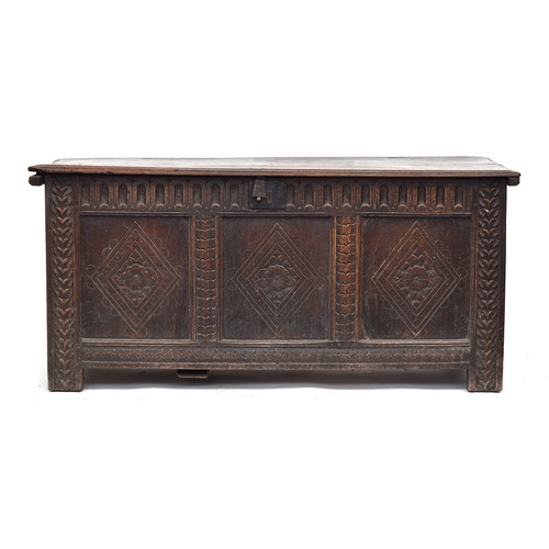 365 - A 17th century carved oak three panel coffer, 133cm wide, 55cm deep, 61cm high