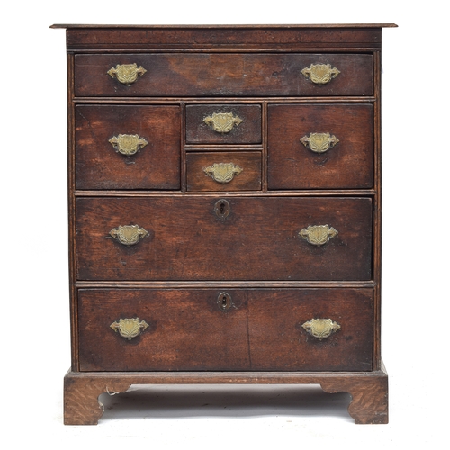 376 - A late 17th/early 18th century joined oak chest of drawers, with an arrangement of seven drawers, pa... 