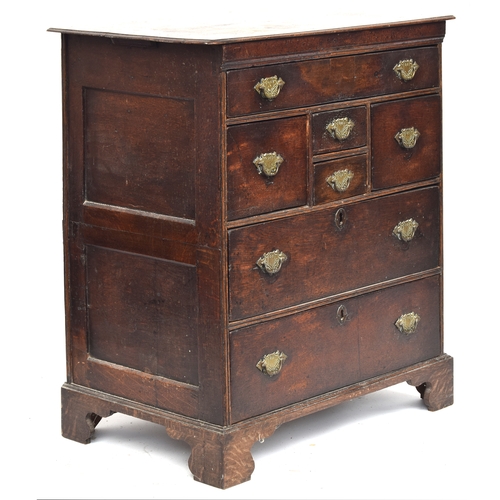 376 - A late 17th/early 18th century joined oak chest of drawers, with an arrangement of seven drawers, pa... 