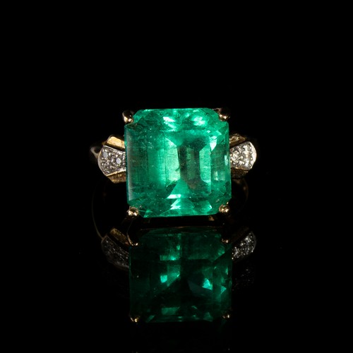 39 - An 18ct gold, emerald and diamond ring, the Muzo Colombian emerald 8.69cts and 12.5x12mm, size N 1/2... 