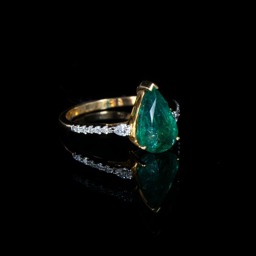 40 - An 18ct gold, emerald and diamond ring, the pear cut Zambian emerald 2.4cts and 11x7mm, size N 1/2, ... 