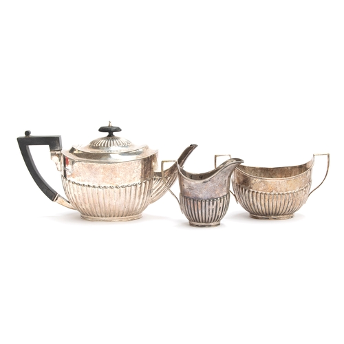 185 - A late Victorian three piece silver tea set by William Hutton & Sons Ltd, London 1899, comprising te... 