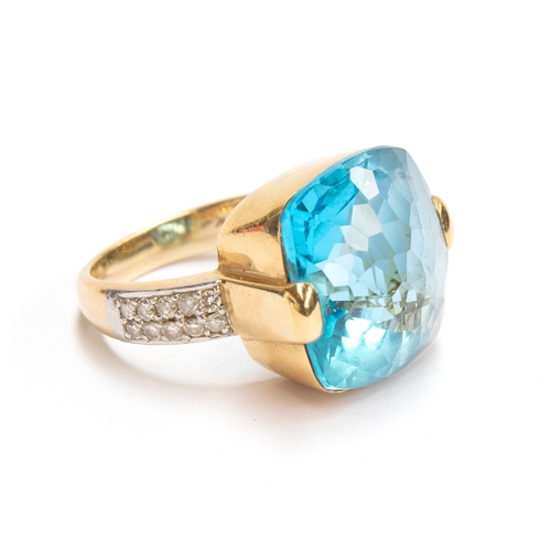 29 - A heavy 18ct gold, blue topaz and diamond ring, the topaz 11x11mm, size O, 14g