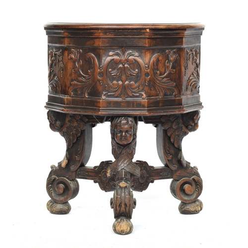 352 - A 17th century and later barrel chair, the base formed as three winged cherubs, the later seat with ... 