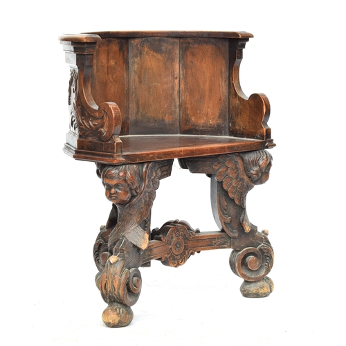 352 - A 17th century and later barrel chair, the base formed as three winged cherubs, the later seat with ... 