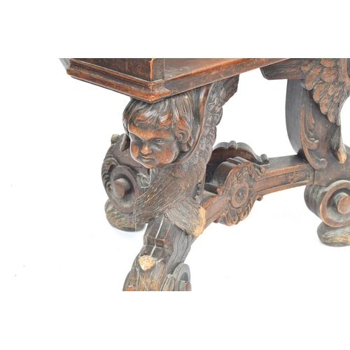 352 - A 17th century and later barrel chair, the base formed as three winged cherubs, the later seat with ... 