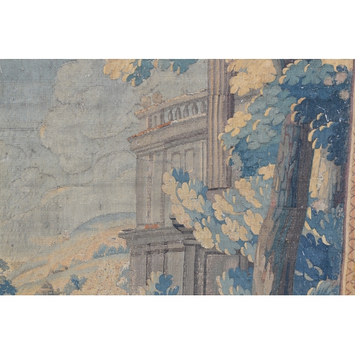 351 - An 18th century Soho tapestry, depicting a knight and lady in a landscape, with maze in background, ... 