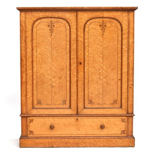 423 - A Victorian burr maple wardrobe, the two domed panelled doors opening to an interior for slides conv... 