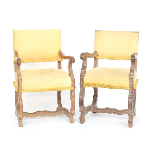 461 - A near pair of oak 'os de mouton' mutton bone chairs, with upholstered backs and seats, the legs joi... 