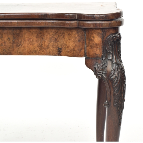 373 - A George II walnut gateleg card table, with foldover top opening to a grospoint interior depicting c... 