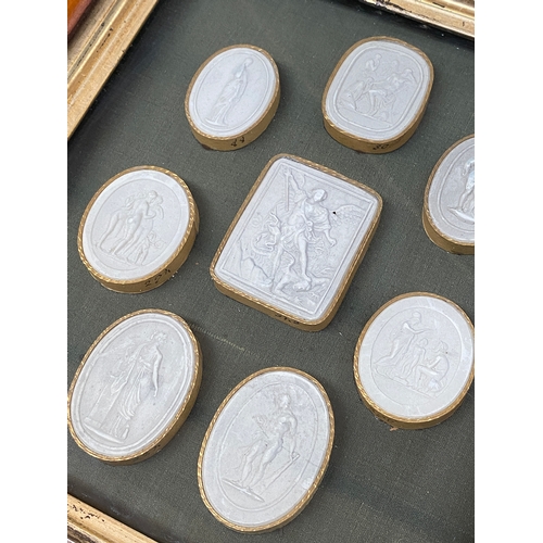 127 - Two framed sets of Victorian Grand Tour plaster intaglios, the largest depicting Archangel Saint Mic... 