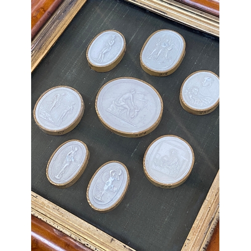 127 - Two framed sets of Victorian Grand Tour plaster intaglios, the largest depicting Archangel Saint Mic... 