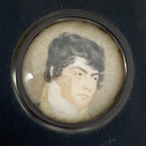 138 - An Regency portrait miniature of a handsome young man, in ebonised frame, 3.6cm diameter

Provenance... 