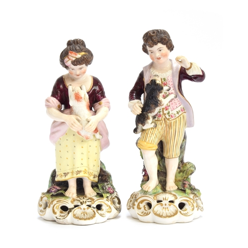 173 - A pair of 19th century Derby figures of a young boy holding a puppy and girl holding a lamb, puce ma... 